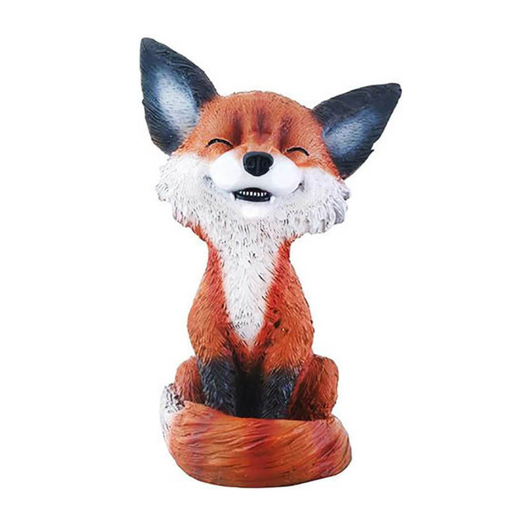 Smiling fox figure sitting with curled tail, created using silicone mold for candle and soap making