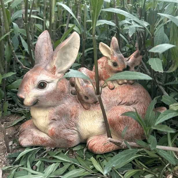 White silicone mold of a sitting large rabbit with baby bunnies – ideal for Candle Making, Soap Making, or Resin Craft.