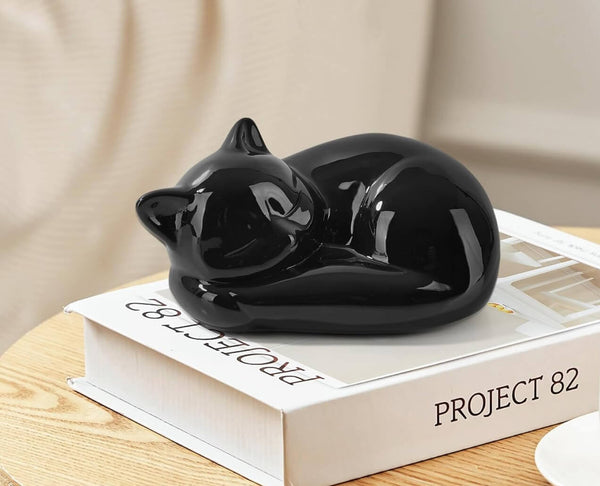 Curled sleeping cat with detailed ears and body, created using silicone mold

