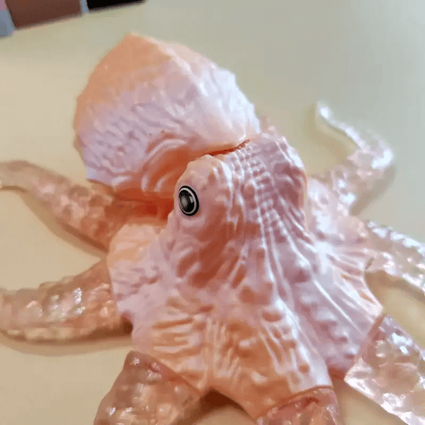 Octopus silicone mold for resin, soap, plaster, and candle crafts, shown with finished sculpture for reference.

