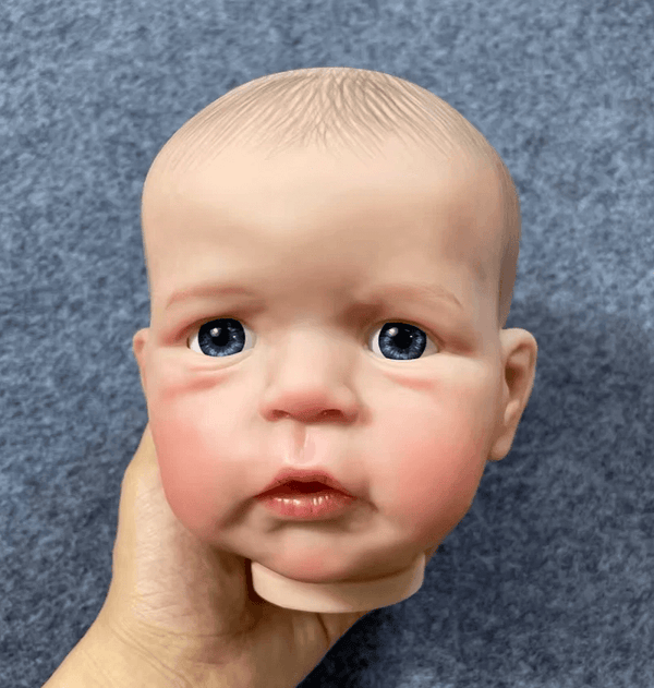 Making a boy baby doll head with soft cheeks and realistic features using a white silicone mold – perfect for resin or soap casting