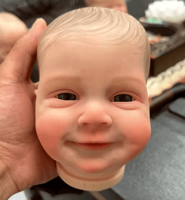 Making a realistic boy doll head with a smiling baby face using a white silicone mold – ideal for resin, plaster, soap, and candle casting