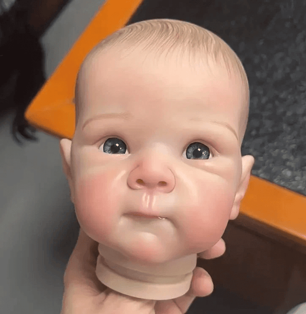 Making a lifelike naked baby boy head using a 4.7 in silicone mold – realistic features, open eyes, soft cheeks – for resin, soap, or candle use