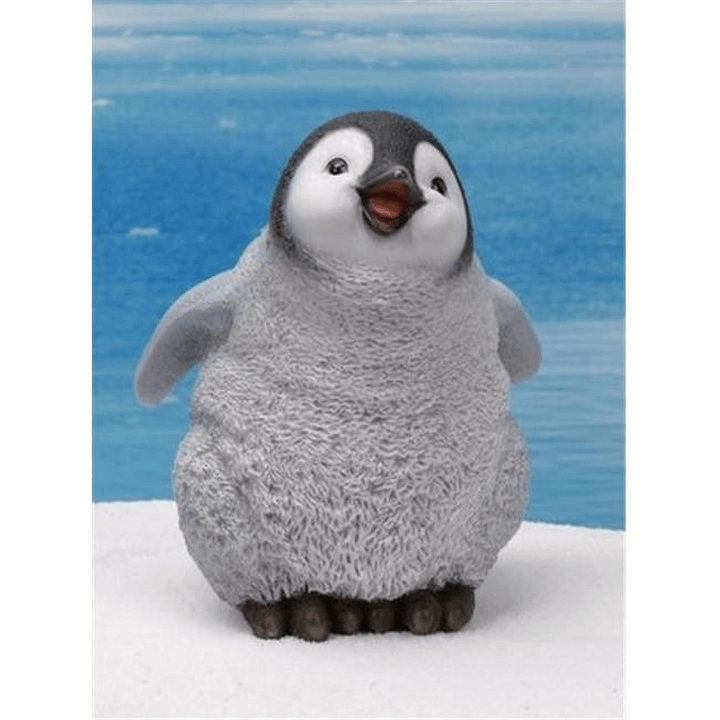 Baby penguin figure standing upright with lifted wings, rounded belly, and soft feather texture, cast using silicone mold for resin or soap

