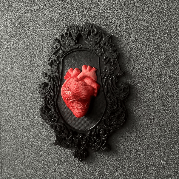 Realistic red anatomical heart in black ornate frame made using white silicone mold – ideal for Candle Making and resin casting