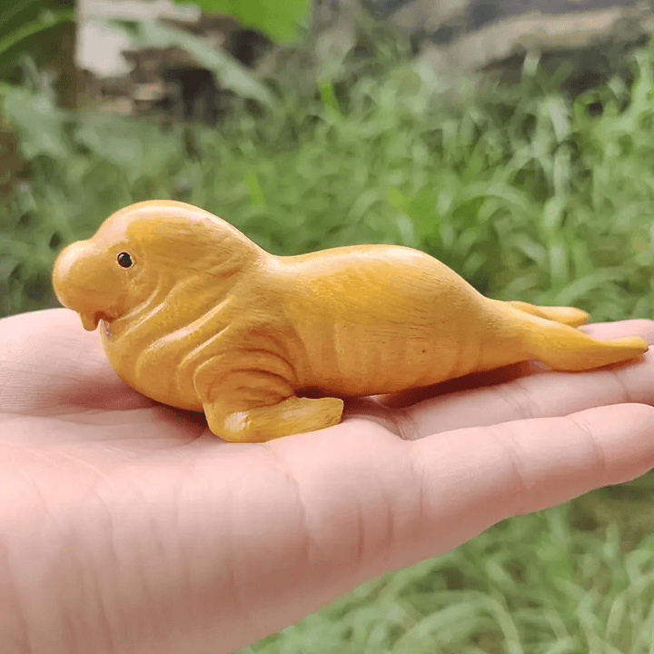 Seal silicone mold for crafting adorable seal figures with resin casting, perfect for marine-themed miniatures or decorative gifts.

