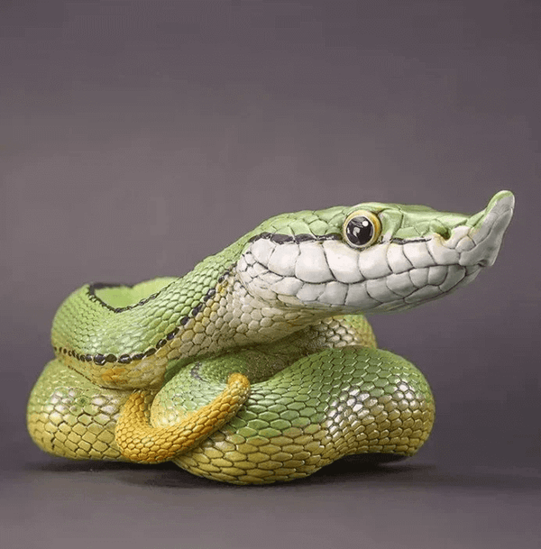 Green snake with lifted snout and cartoon eyes, made using white silicone mold for Candle Making or Resin Art Projects