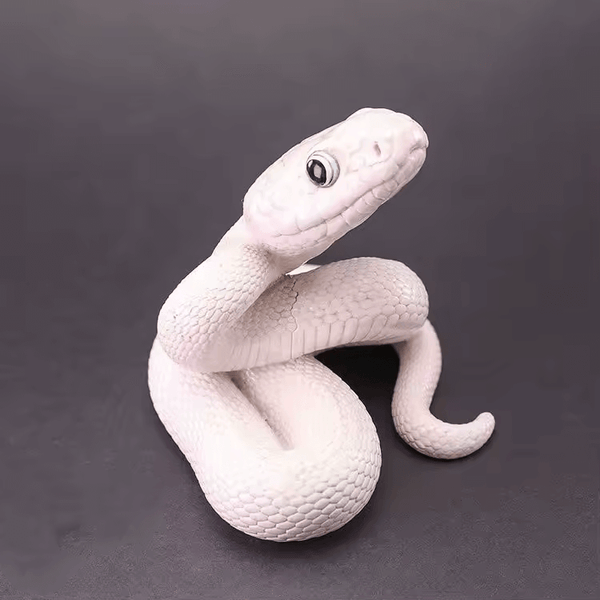 Realistic coiled snake figure with lifted head, created using silicone mold for gothic or fantasy decor


