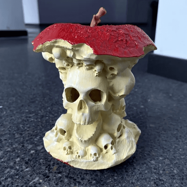 Skull mold with apple top, ideal for resin, soap, plaster, and candle making, created using a silicone mold