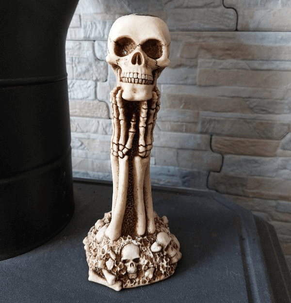 Tall skeleton figure standing on skull base, gothic-style silicone mold with detailed bone structure


