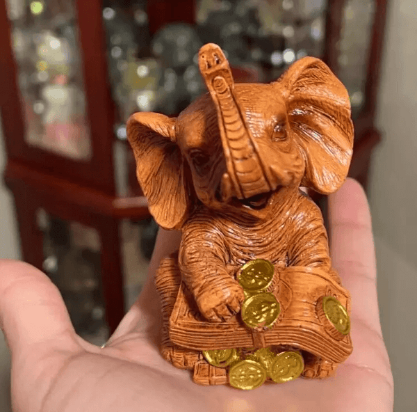 Lucky elephant silicone mold for resin, soap, plaster, and candle crafts, shown with finished figure for reference.

