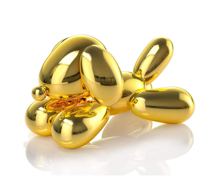 Balloon dog figure with glossy sculptural finish, upright ears, and curved tail, cast using silicone mold in gold resin or soap

