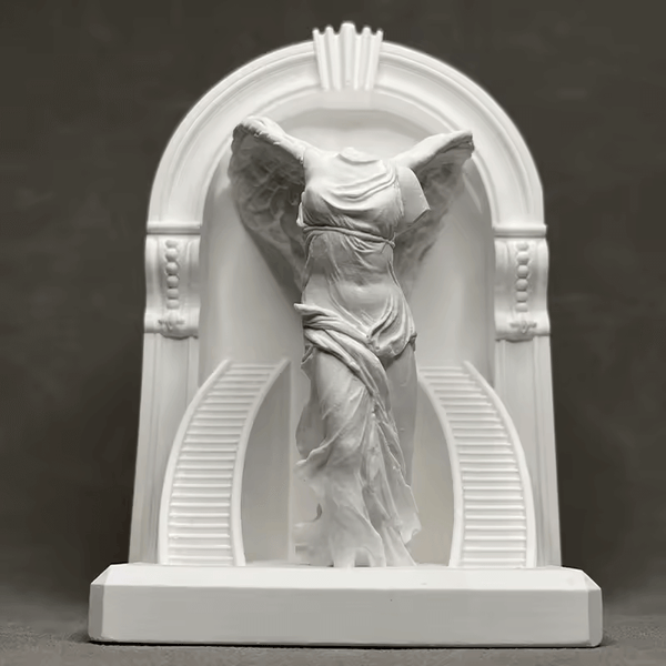 Winged goddess figure draped in flowing robes under classical arch, created with silicone mold


