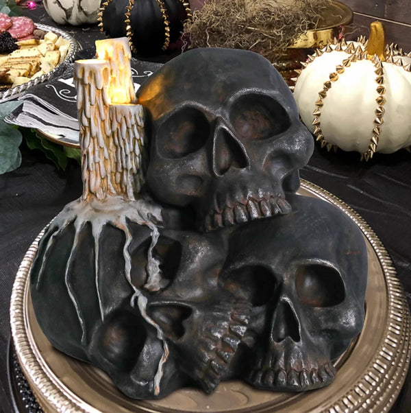 Three black skulls clustered together in haunting formation, created using silicone mold for Halloween or gothic home décor



